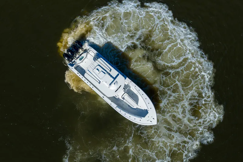 Slide: The Image of Aerial view of 2024 Yellowfin 39 Offshore boat making a circular wake. - 11