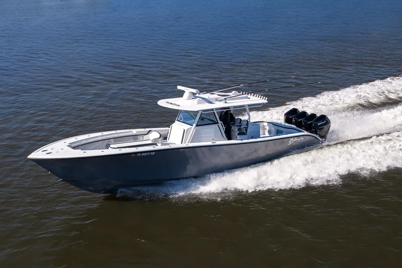 Slide: The Image of 2024 Yellowfin 39 Offshore boat cruising on open water, showcasing sleek design and powerful engines. - 16