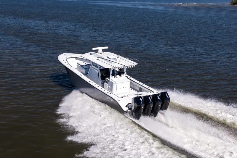Slide: The Image of 2024 Yellowfin 39 Offshore boat cruising on open water with powerful engines. - 17