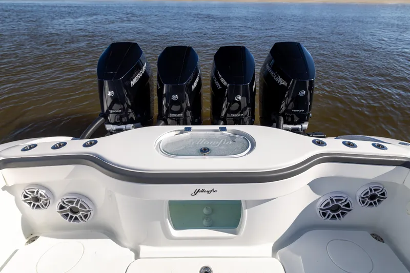 Slide: The Image of 2024 Yellowfin 39 Offshore boat with four powerful Mercury Verado engines on open water. - 23