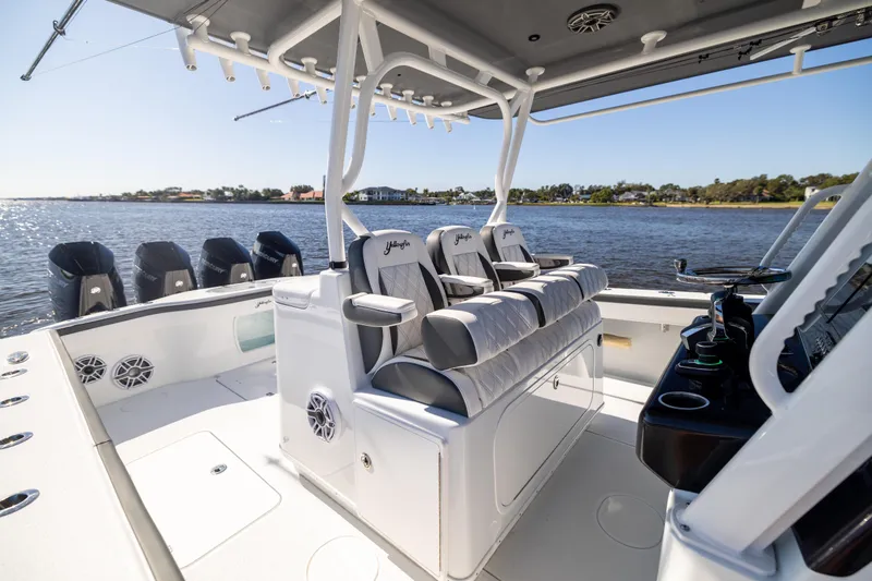 Slide: The Image of 2024 Yellowfin 39 Offshore boat interior with seating and multiple outboard engines. - 27