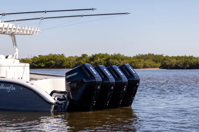 Slide: The Image of 2024 Yellowfin 39 Offshore boat with four Mercury 400 engines on calm water. - 3