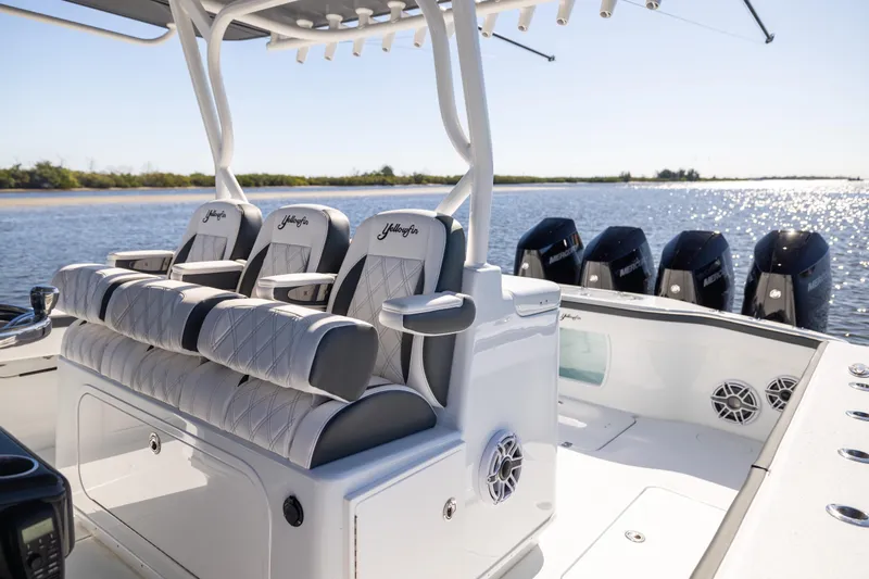 Slide: The Image of 2024 Yellowfin 39 Offshore boat interior with luxurious seating and multiple outboard engines. - 30