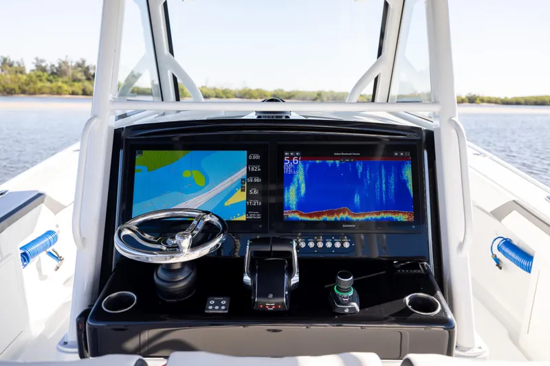 Slide: The Image of 2024 Yellowfin 39 Offshore boat dashboard with advanced navigation displays. - 34