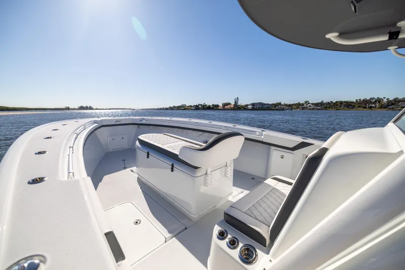 Slide: The Image of 2024 Yellowfin 39 Offshore boat interior with seating, on a sunny day. - 43