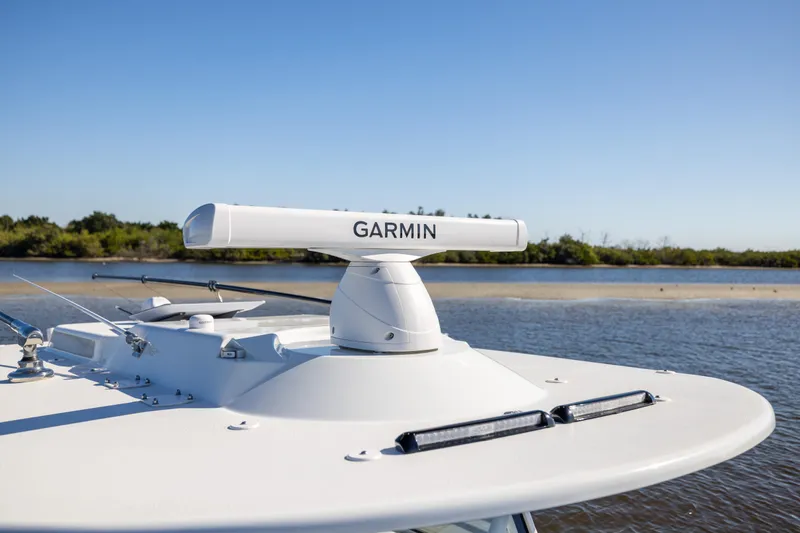 Slide: The Image of 2024 Yellowfin 39 Offshore boat with Garmin radar on calm water. - 47