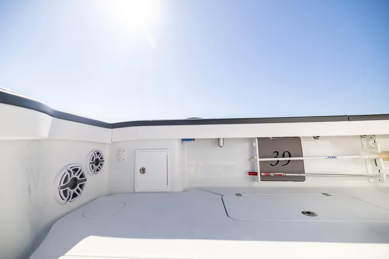 Slide: The Image of 2024 Yellowfin 39 Offshore boat interior with speakers and storage compartments. - 50