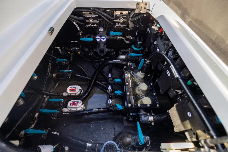 Slide: The Image of Engine compartment of 2024 Yellowfin 39 Offshore boat, showcasing intricate wiring and components. - 56