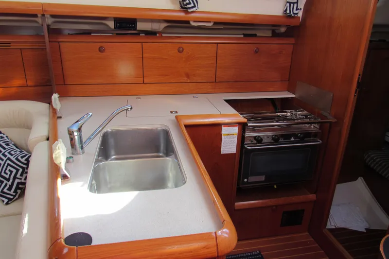 Slide: The Image of Interior view of 2004 Jeanneau Sun Odyssey 37 yacht kitchen with sink and stove. - 11