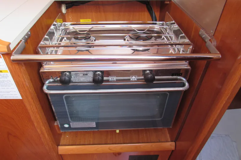 Slide: The Image of 2004 Jeanneau Sun Odyssey 37 yacht kitchen with stainless steel stove and oven. - 12
