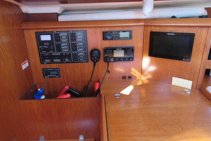 Slide: The Image of Control panel of a 2004 Jeanneau Sun Odyssey 37 sailboat with navigation equipment. - 15