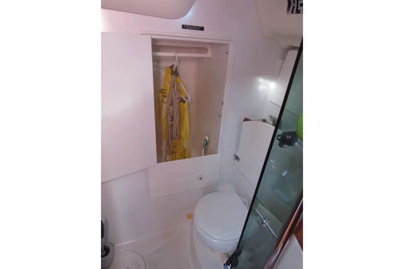 Slide: The Image of Bathroom interior of 2004 Jeanneau Sun Odyssey 37 sailboat, featuring a compact design. - 18
