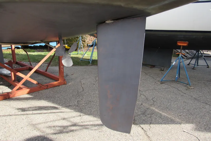 Slide: The Image of 2004 Jeanneau Sun Odyssey 37 sailboat keel and propeller on dry dock. - 22