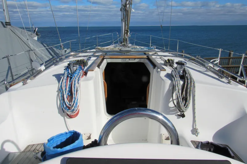 Slide: The Image of Cockpit view of 2004 Jeanneau Sun Odyssey 37 sailboat with ocean backdrop. - 24