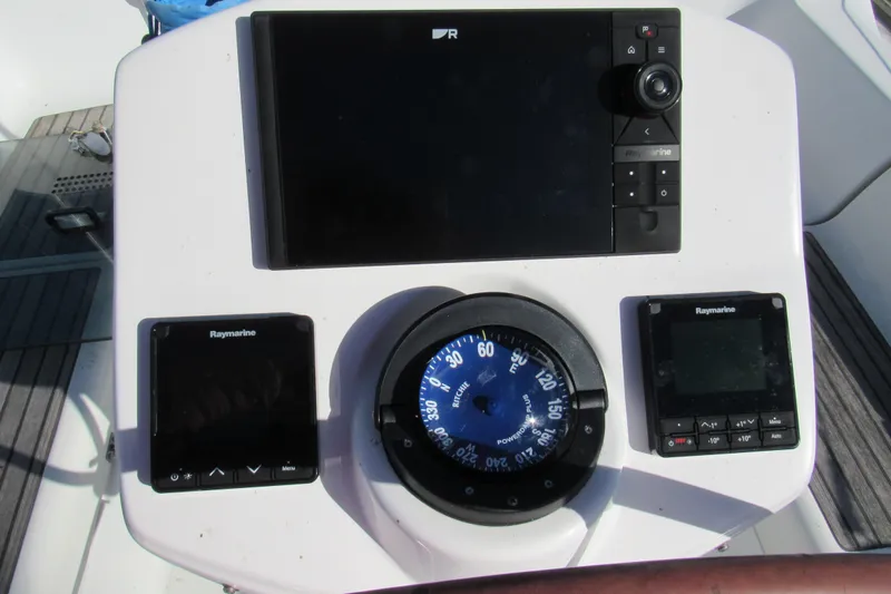 Slide: The Image of Control panel of 2004 Jeanneau Sun Odyssey 37 with Raymarine instruments and compass. - 25