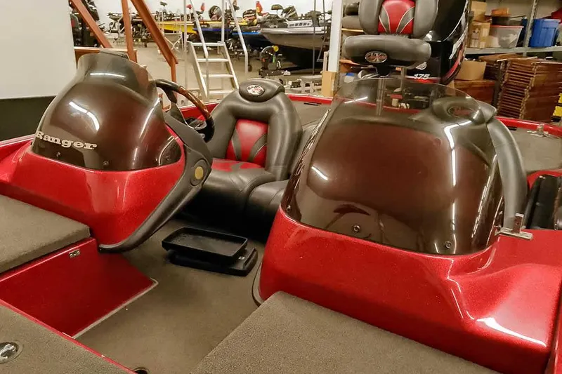 Slide: The Image of 2005 Ranger 185 VX boat interior with dual consoles and seating. - 11