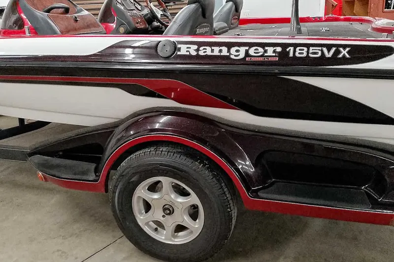 Slide: The Image of 2005 Ranger 185 VX boat with sleek design and red accents. - 12