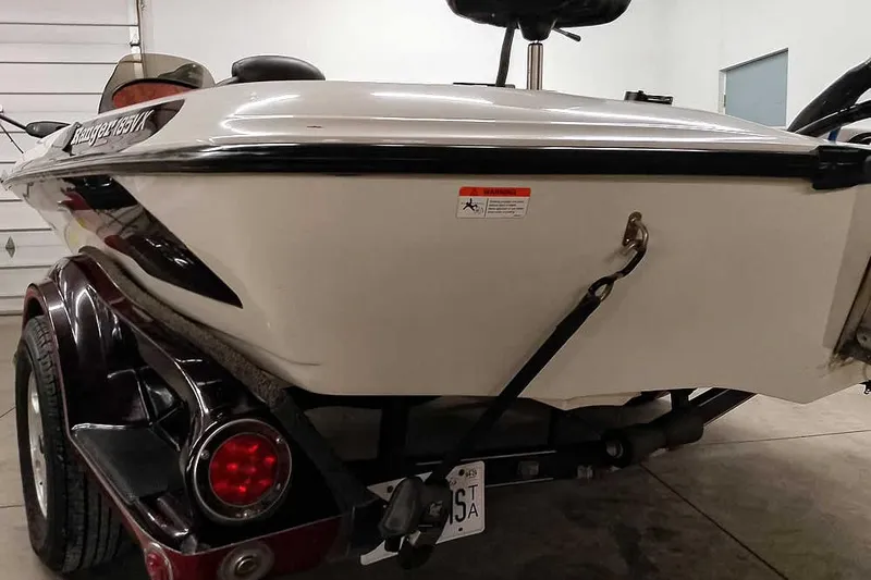 Slide: The Image of 2005 Ranger 185 VX boat on trailer, rear view in garage setting. - 13