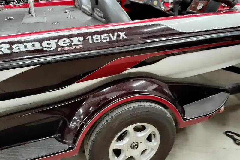 Slide: The Image of 2005 Ranger 185 VX boat with detailed side view and trailer tire. - 15