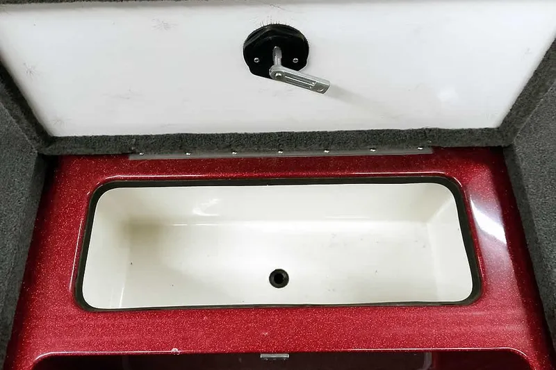 Slide: The Image of 2005 Ranger 185 VX boat compartment with red trim and white interior. - 18