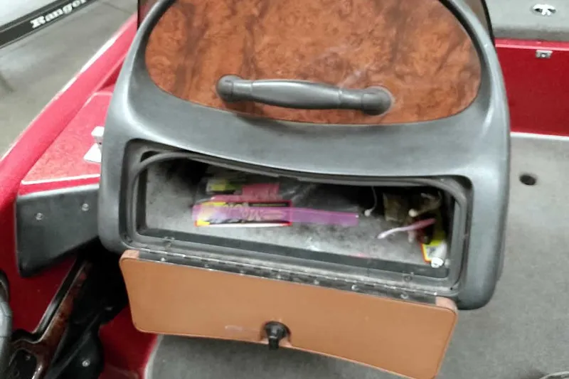 Slide: The Image of Open storage compartment in 2005 Ranger 185 VX boat, showing interior contents. - 29