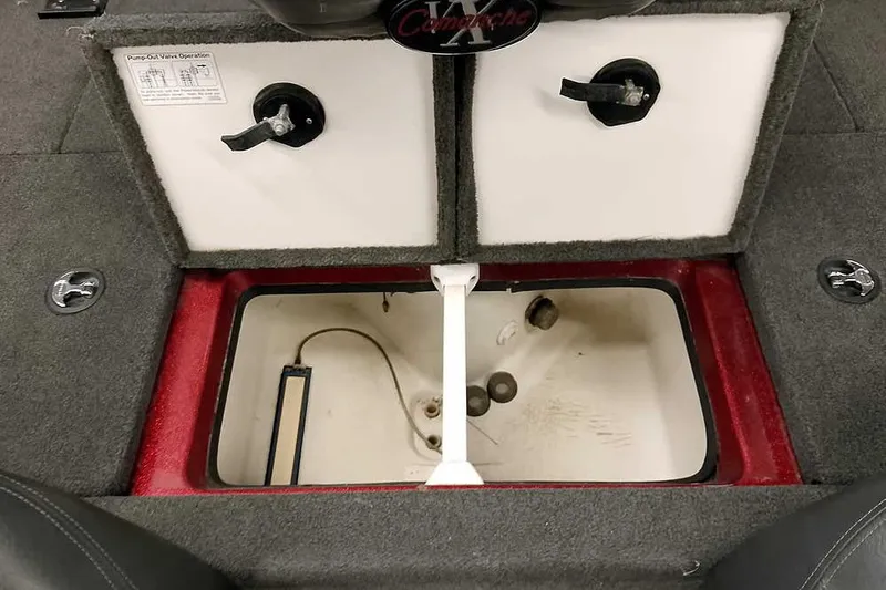 Slide: The Image of 2005 Ranger 185 VX boat storage compartment with pump-out valve controls. - 35