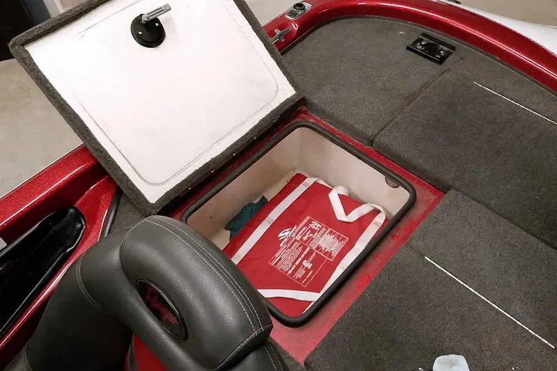 Slide: The Image of 2005 Ranger 185 VX boat storage compartment with life jacket inside. - 37