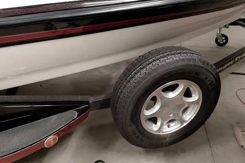 Slide: The Image of 2005 Ranger 185 VX boat trailer with tire and wheel detail in a garage setting. - 42