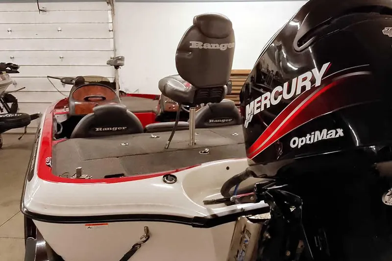 Slide: The Image of 2005 Ranger 185 VX boat with Mercury OptiMax engine in a garage. - 46