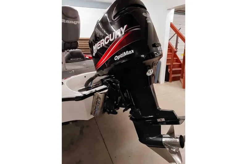 Slide: The Image of 2005 Ranger 185 VX boat with Mercury OptiMax outboard motor in a garage. - 47
