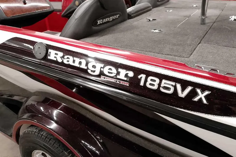 Slide: The Image of 2005 Ranger 185 VX boat, red and black design, close-up view. - 5