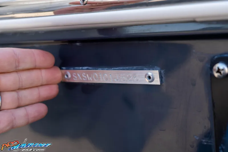 Slide: The Image of Hand pointing to the hull identification number on a 2026 Sea Hunt Gamefish 28 Coffin Box boat. - 11