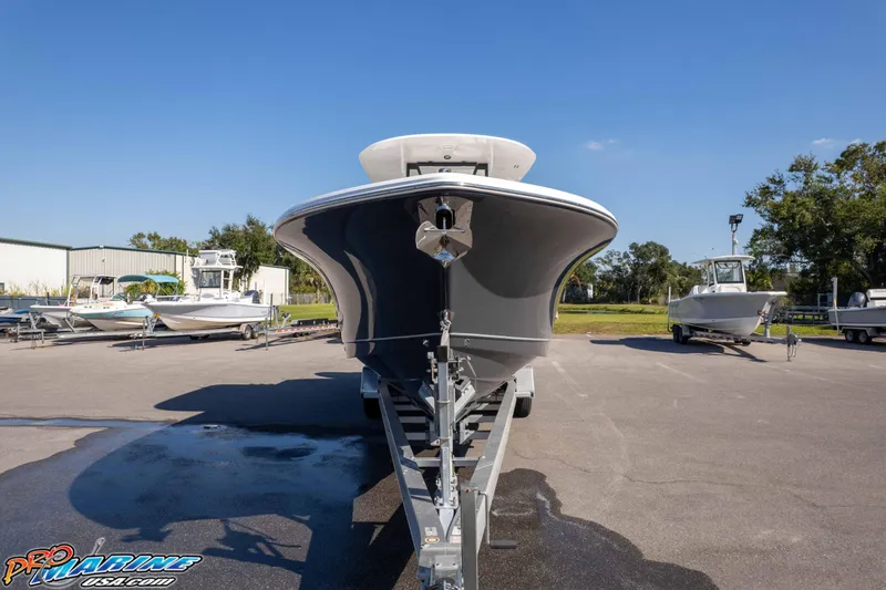 Slide: The Image of 2026 Sea Hunt Gamefish 28 Coffin Box boat on trailer in sunny outdoor setting. - 4