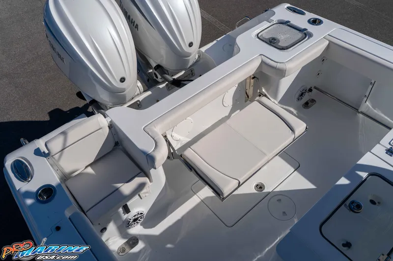 Slide: The Image of 2026 Sea Hunt Gamefish 28 Coffin Box boat with Yamaha engines, featuring spacious seating and storage. - 49