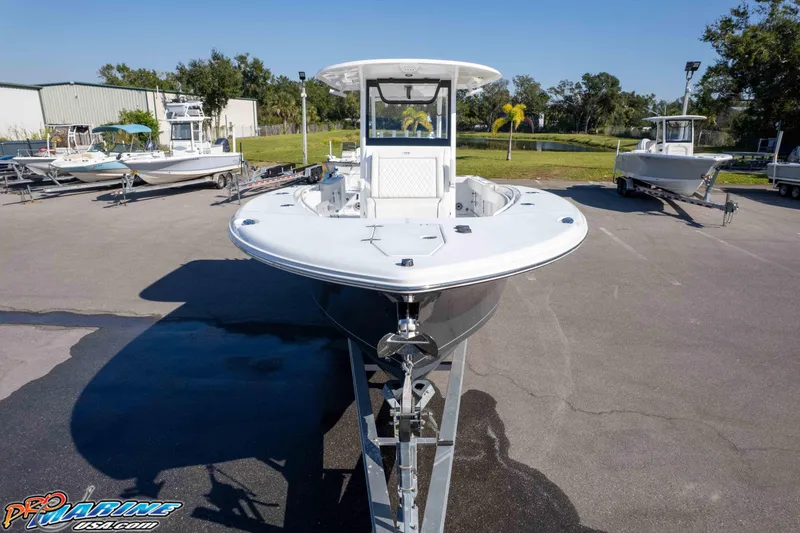 Slide: The Image of 2026 Sea Hunt Gamefish 28 Coffin Box boat on trailer in outdoor setting. - 5