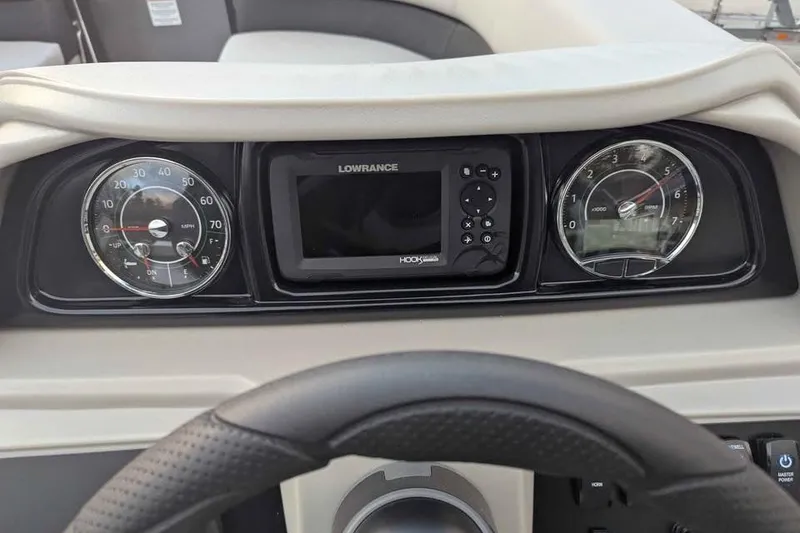 Slide: The Image of Dashboard of 2026 Dockside 22DQ boat with Lowrance display and gauges. - 12