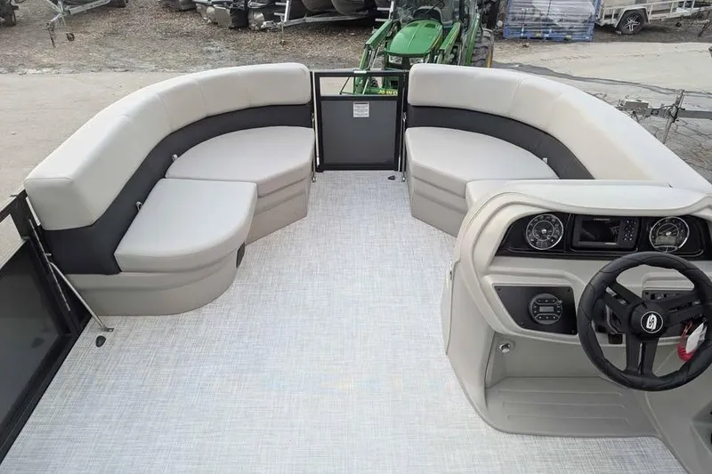 Slide: The Image of 2026 Dockside 22DQ boat interior with plush seating and modern dashboard. - 7