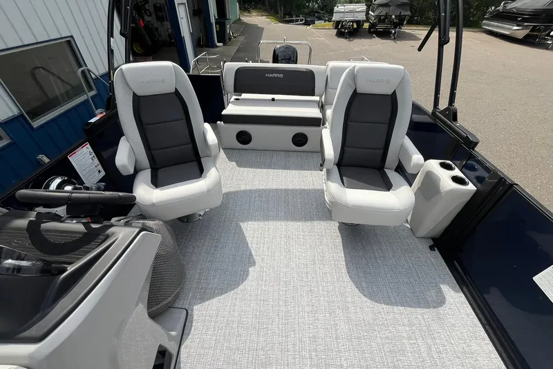 Slide: The Image of 2026 Harris Cruiser 210 boat interior with plush seating and modern design. - 10