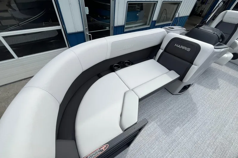 Slide: The Image of 2026 Harris Cruiser 210 boat interior with plush seating and modern design. - 8