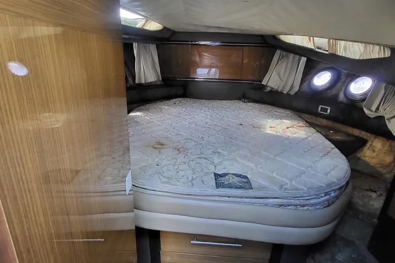 Slide: The Image of Cabin interior of 2008 Marquis 40 SC yacht with bed and porthole windows. - 22