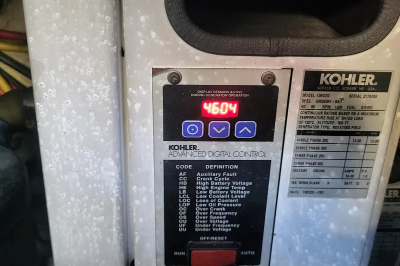 Slide: The Image of Kohler generator control panel displaying 4604 hours on a Marquis 40 SC, 2008 model. - 24