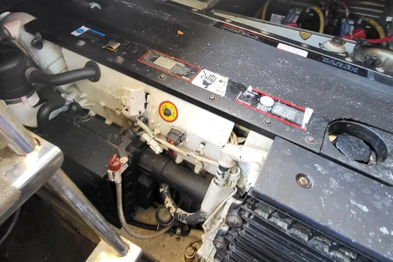 Slide: The Image of Engine compartment of a 2008 Marquis 40 SC yacht, showcasing mechanical components and wiring. - 26