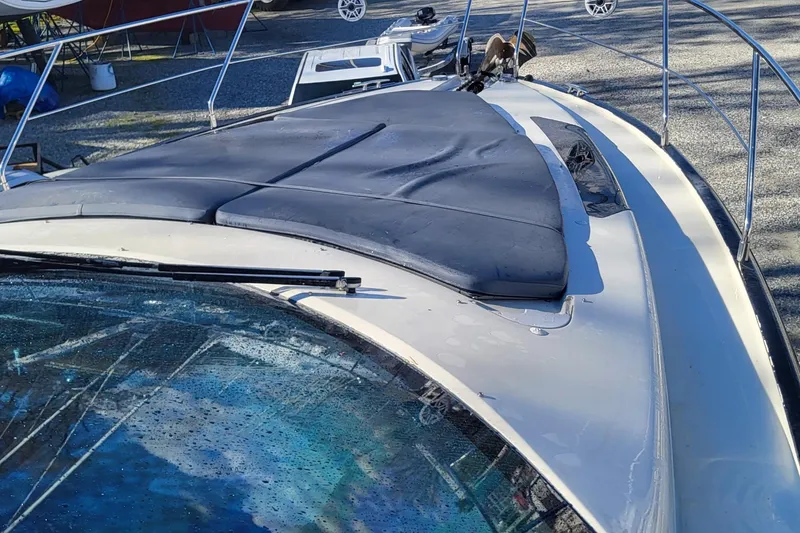 Slide: The Image of 2008 Marquis 40 SC yacht with sleek deck and windshield, docked outdoors. - 27