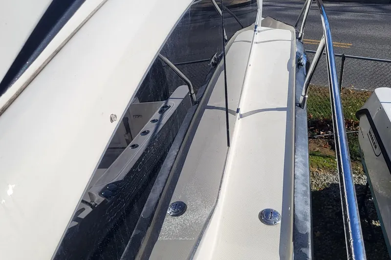 Slide: The Image of 2008 Marquis 40 SC yacht deck with sleek design and chrome railings. - 5