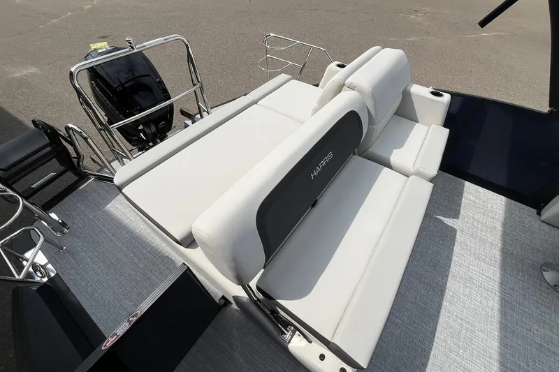Slide: The Image of 2026 Harris Cruiser 210 boat interior with plush seating and sleek design. - 13
