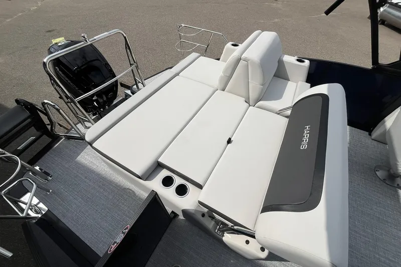 Slide: The Image of 2026 Harris Cruiser 210 boat with spacious seating and modern design. - 14