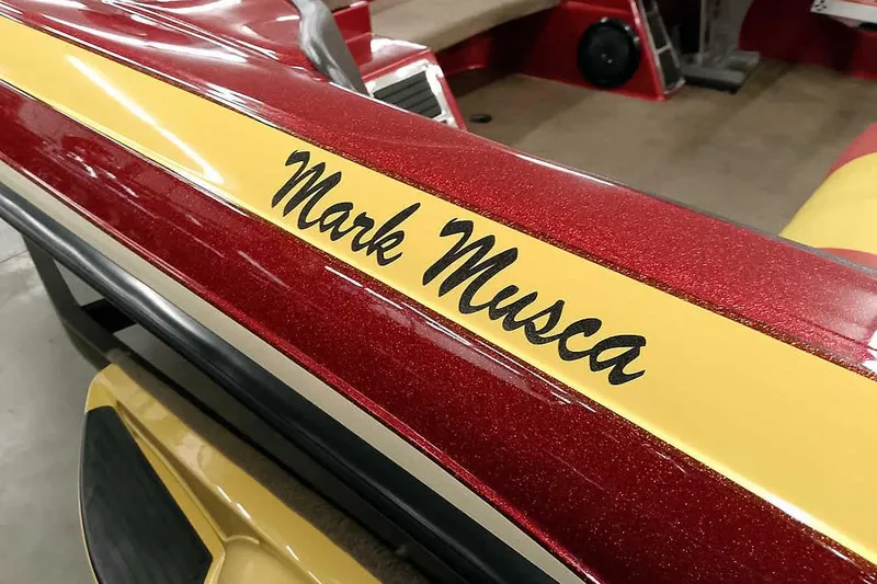 Slide: The Image of 2008 Ranger Z520 Comanche boat with custom "Mark Musca" decal on red and yellow finish. - 11