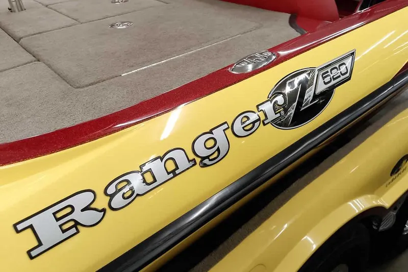 Slide: The Image of 2008 Ranger Z520 Comanche boat, yellow with red accents, close-up of logo and deck. - 15