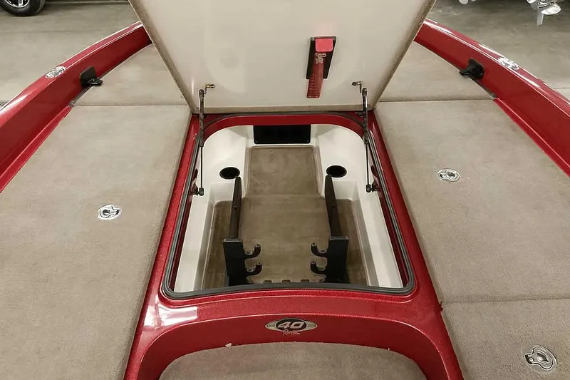 Slide: The Image of 2008 Ranger Z520 Comanche boat storage compartment with open lid, red and beige interior. - 21