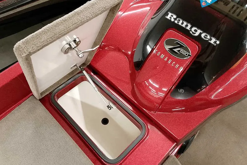 Slide: The Image of 2008 Ranger Z520 Comanche boat interior with storage compartment and red finish. - 23